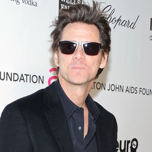 Jim Carrey Wears Enormous Prosthetic Feet, Tiny Angel Wings To Elton 