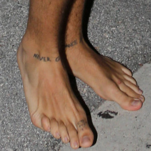 One Direction S Harry Styles Reveals New George Michael Inspired Ankle Tattoos—check It Out E
