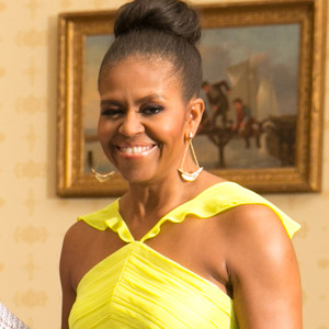 michelle obama in yellow dress and boots