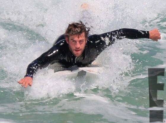 Liam Hemsworth Is Shirtless Surfing And Showering—see The