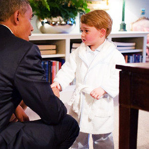 Prince George meets Barack Obama in his dressing gown and 