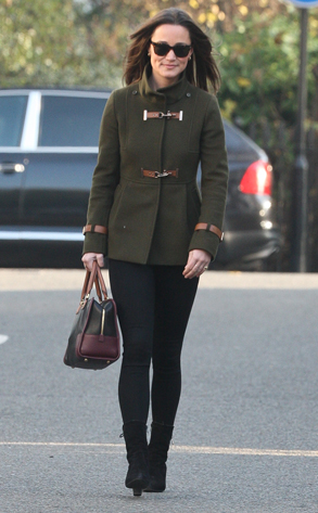 Pippa Middleton was seen out and about keeping warm in a green coat, black  leggings, brown knee high boots matched with black purse and dark  sunglasses. London, UK. 2nd December 2011 Stock