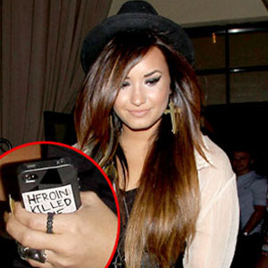 What's Up With Demi Lovato's Heroin Sticker? - E! Online