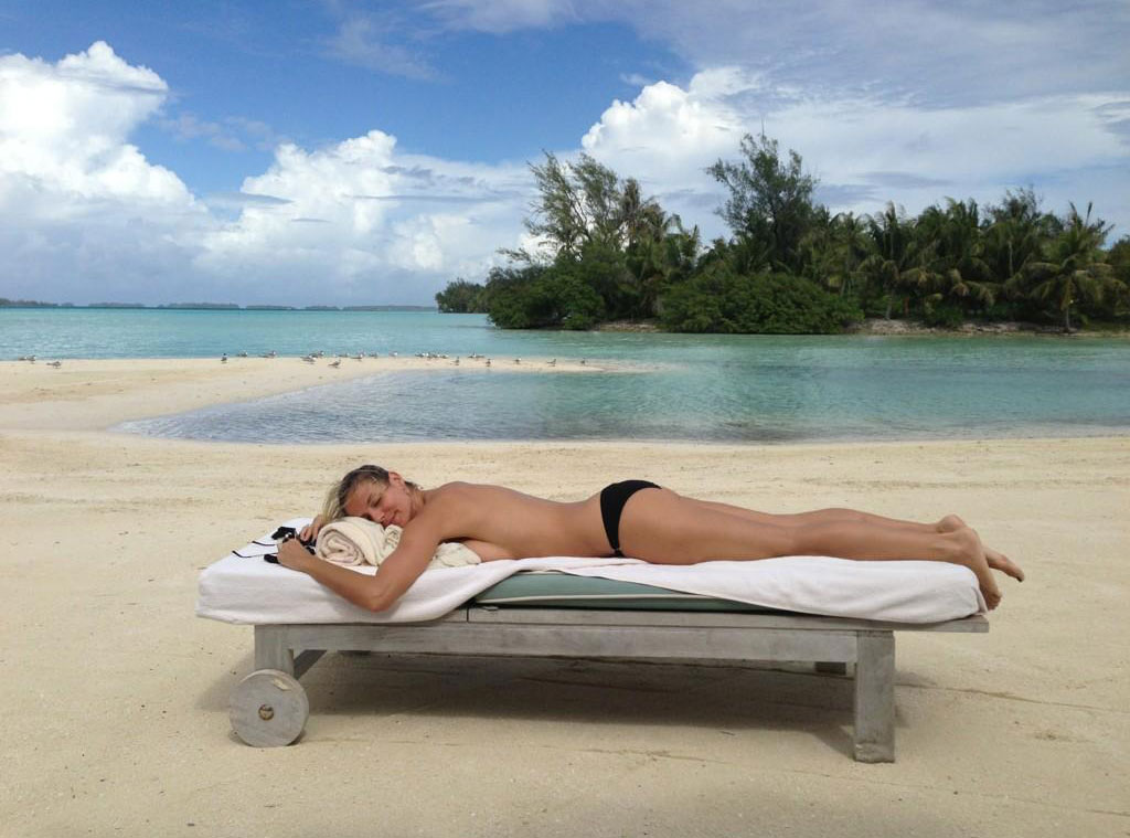 Heidi Klum Tweets Topless Sunbathing