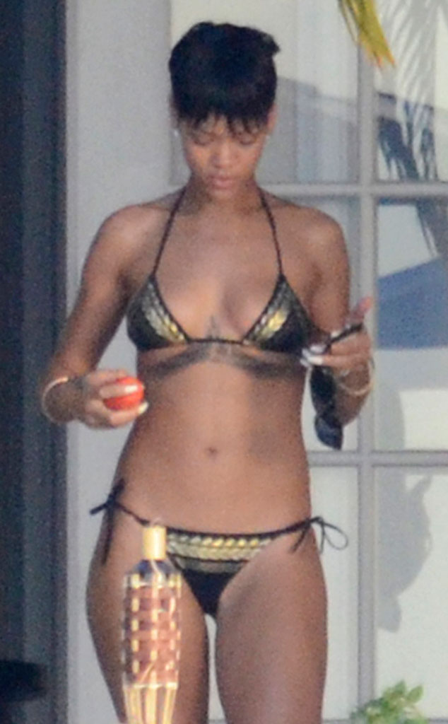 Golden Touch From Rihannas Many Many Bikini Pics E News 