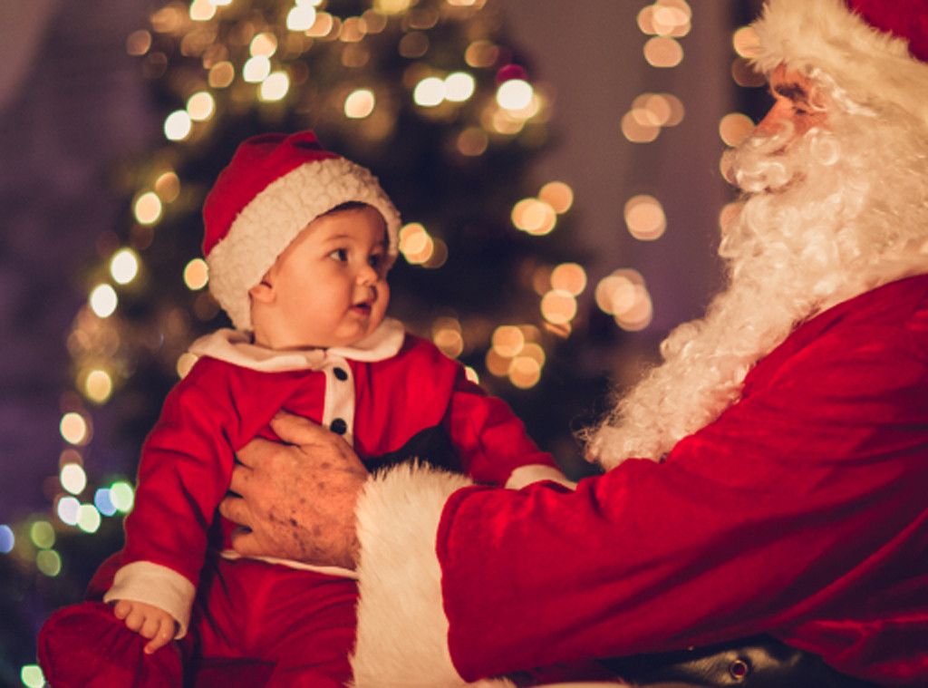 christmas baby photoshoot ideas on santa’s hands