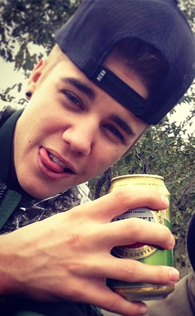 Justin Bieber Drinks Beer in the Wild, Hangs With Elephants