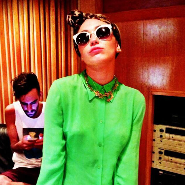 Miley Cyrus Wears Green Shirt, Swag Glasses in Studio Pic - E! Online - AU