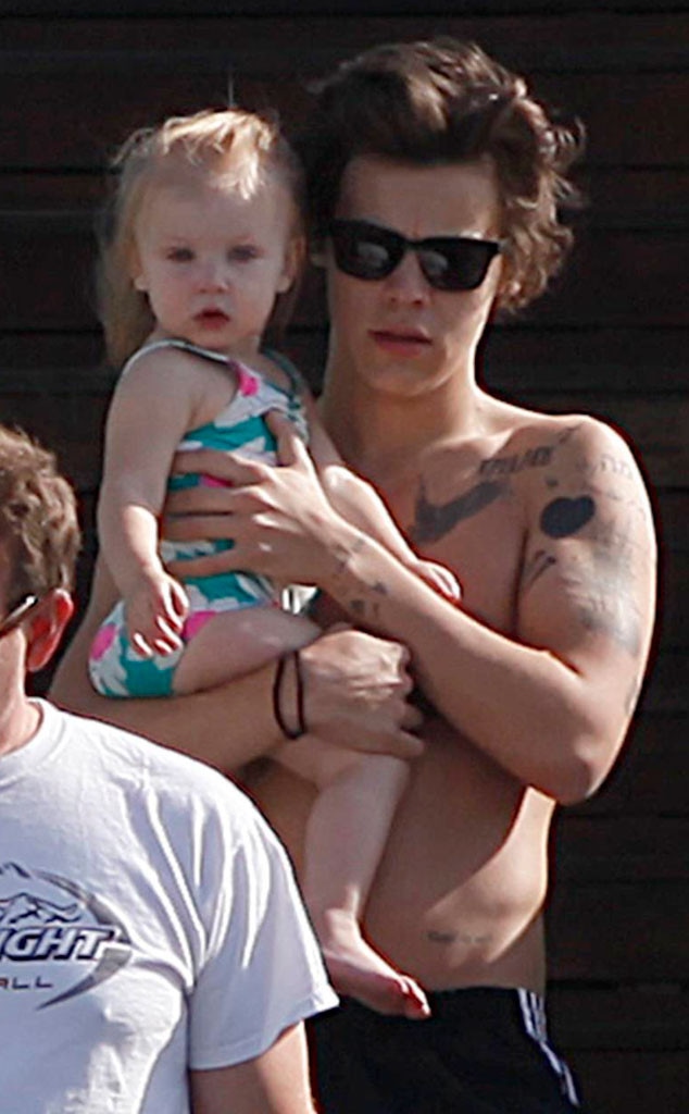 Harry Styles Goes Shirtless, Holds a Baby - E! Online