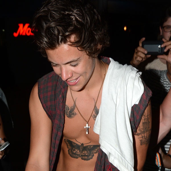 Harry Styles shows off his random tattoos in canary yellow shorts on the  beach Down Under  Daily Star
