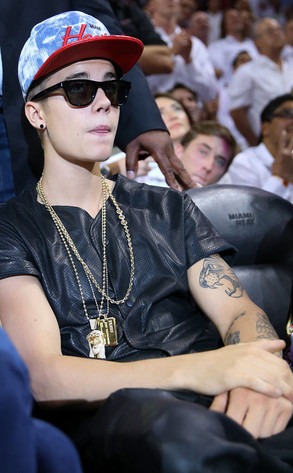 Justin Bieber Wears Leather, Gold Chains to Miami Heat Game, Teases New