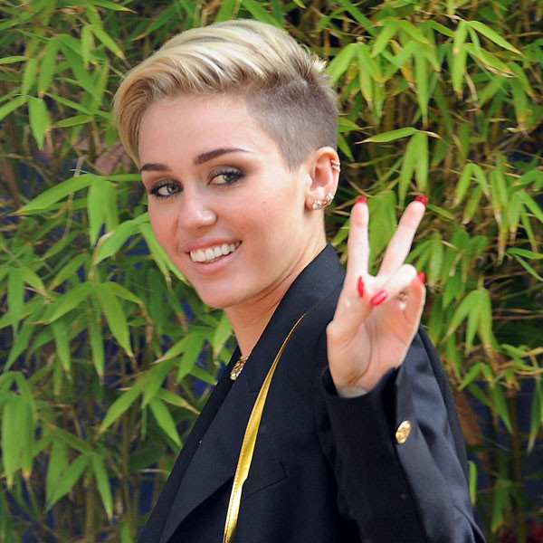 Miley Laments Food Poisoning in Germany - E! Online
