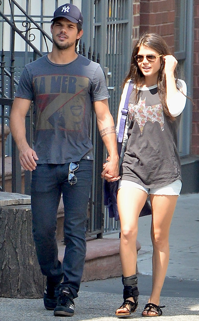 taylor lautner and marie avgeropoulos holding hands
