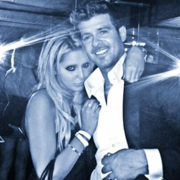 Robin Thicke posts pic of wife's near nip slip days after controversial  'mirror' photo