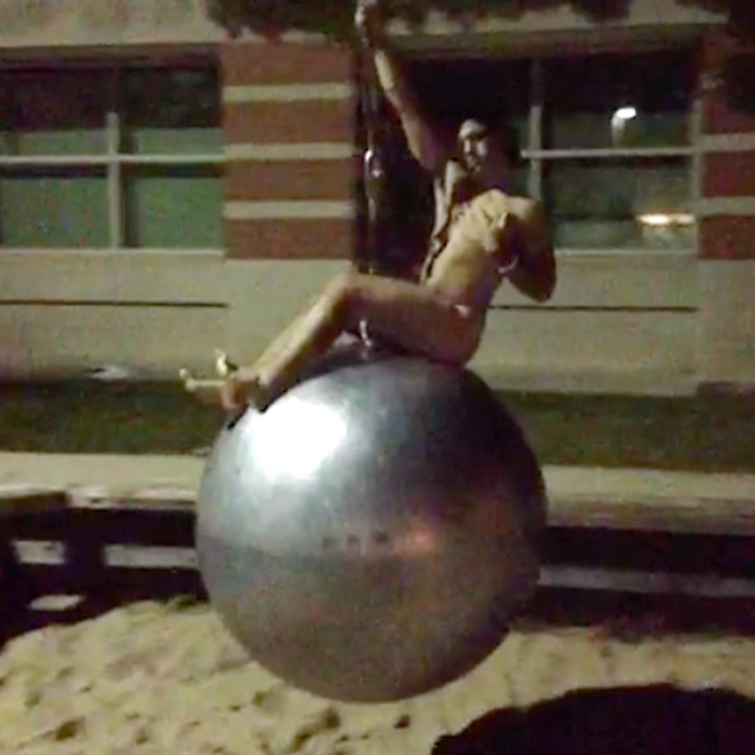 PIC - A Naked Miley Cyrus Sitting On A Wrecking Ball - EzKool