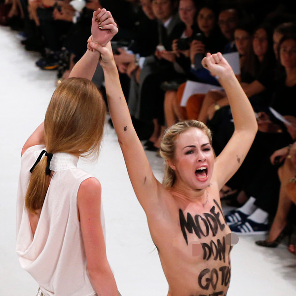 Model Punches Topless Protester on the Runway