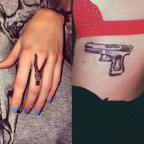 Micro-realistic revolver tattoo on the inner forearm