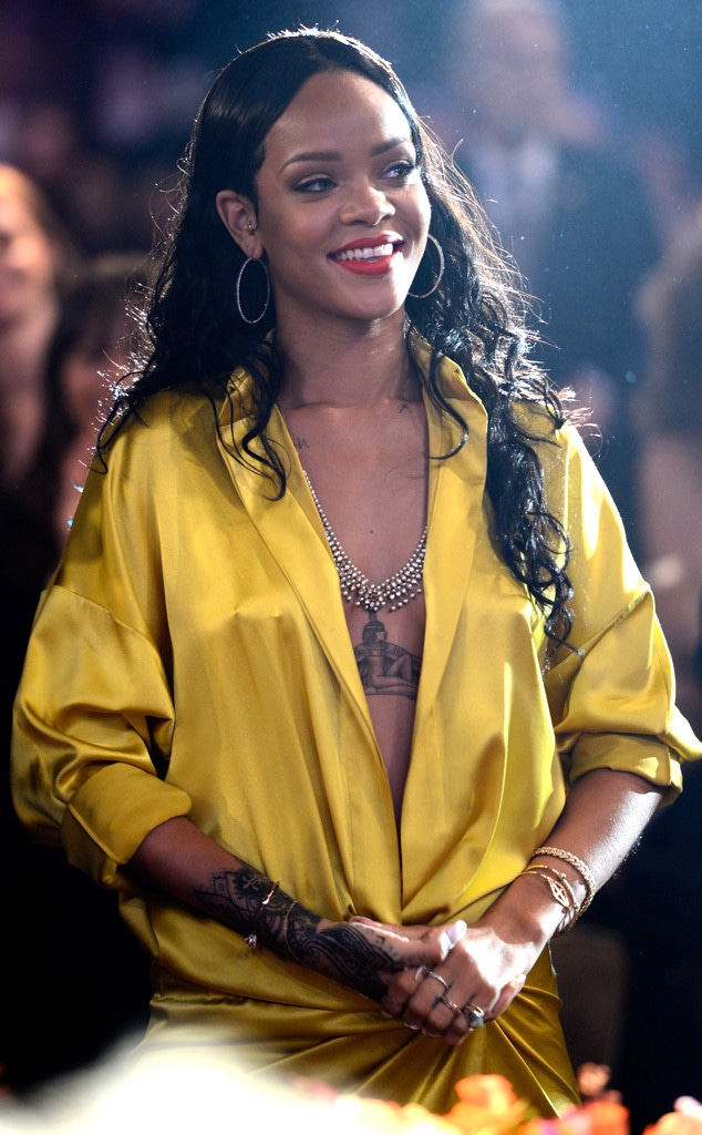 Rihanna Wows in Revealing Yellow Silk Robe Rihanna Wows in Revealing Yellow Silk Robe