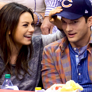 Mila Kunis and Ashton Kutcher Smooch for the Los Angeles Clippers Kiss ...