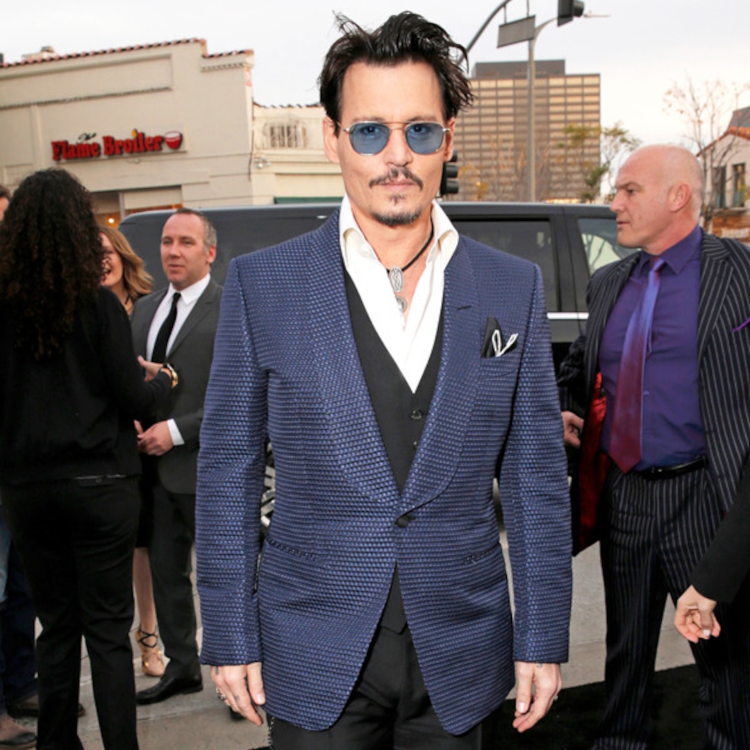 Johnny Depp Hits Red Carpet Sans Amber Heard