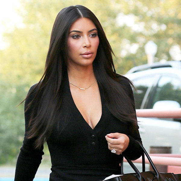 Photos and Pictures - Wearing light makeup, Kim Kardashian looks very casual  and comfortable in a black outfit and sandals as she gets in a day of  shopping. Kim stopped in at