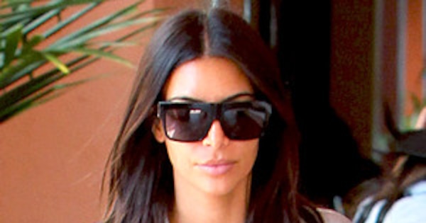 Kim Kardashian Ignores Buttons, Lets Cleavage Bust Out On 
