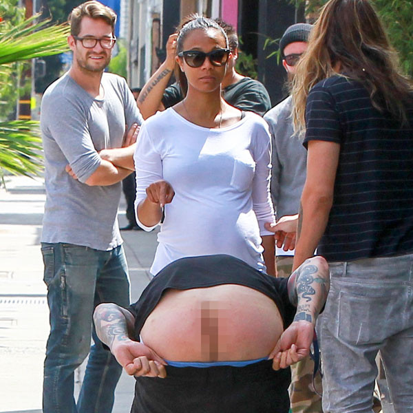 Man Makes an Ass of Himself (Literally) In Front of Zoe Saldana!