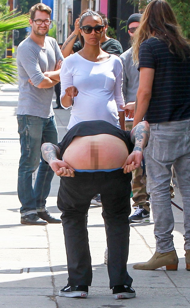 Man Makes an Ass of Himself (Literally) In Front of Zoe Saldana! - E! Online - CA