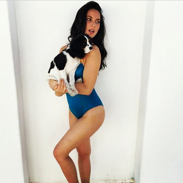 Olivia Munn s Puppy Buries Himself in Her Cleavage See the Pics