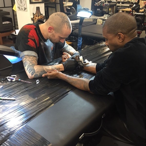 Kanye reveals Saint West neck tattoo as he returns to Twitter  Daily Mail  Online