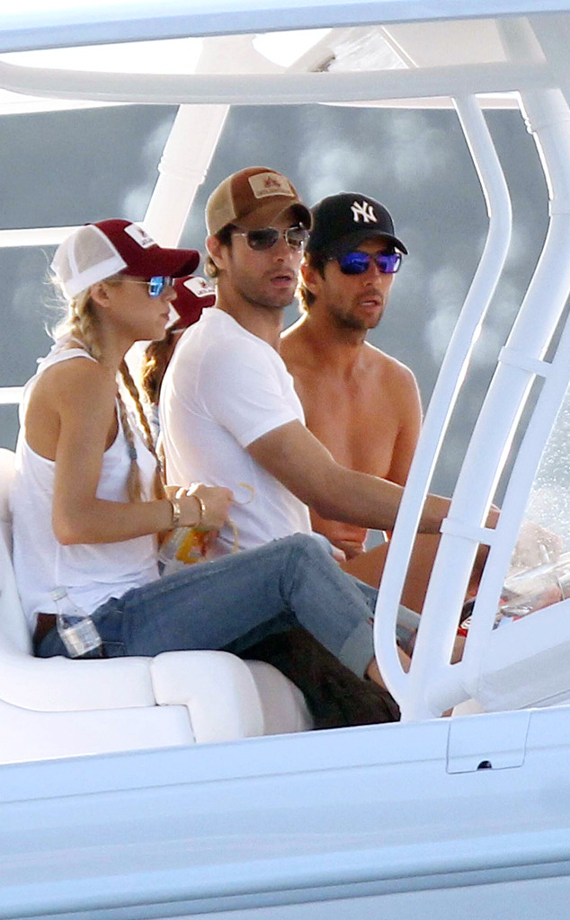 Anna Kournikova and Enrique Iglesias take turns playing captain as they  spend a cosy Easter boating in Miami