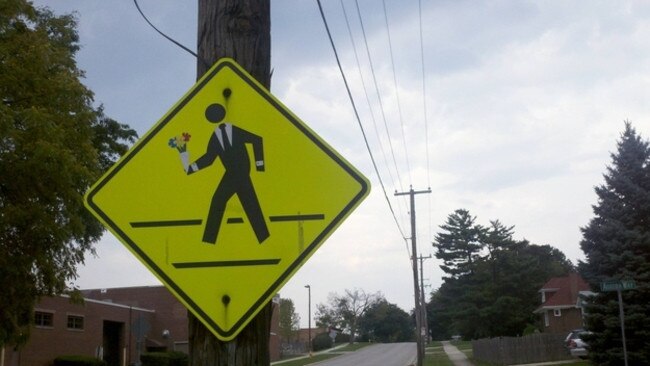 Fancy Man Crossing from Vandalized Signs That Are a Vast Improvement ...