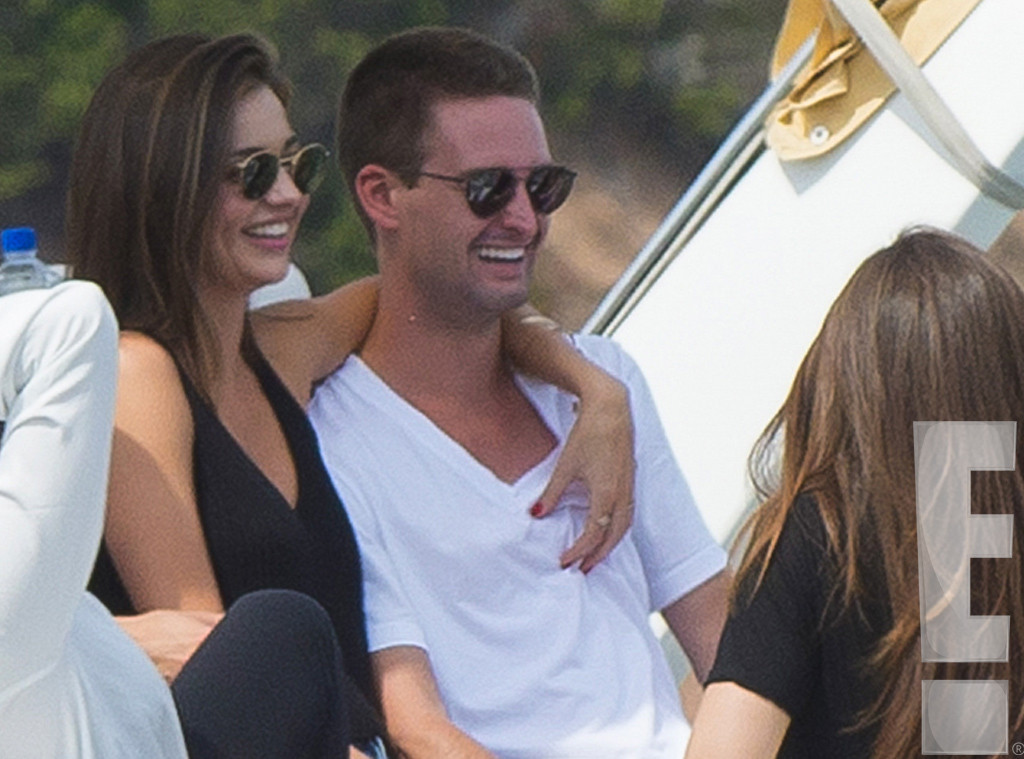 Miranda Kerr and Evan Spiegel pack on the PDA at the Louis Vuitton menswear  show in Paris