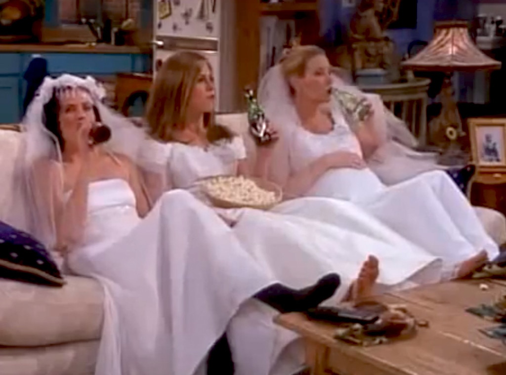 Two Young Women Helping Their Friend Try On A Wedding Dress In A Bridal  Store High-Res Stock Photo - Getty Images