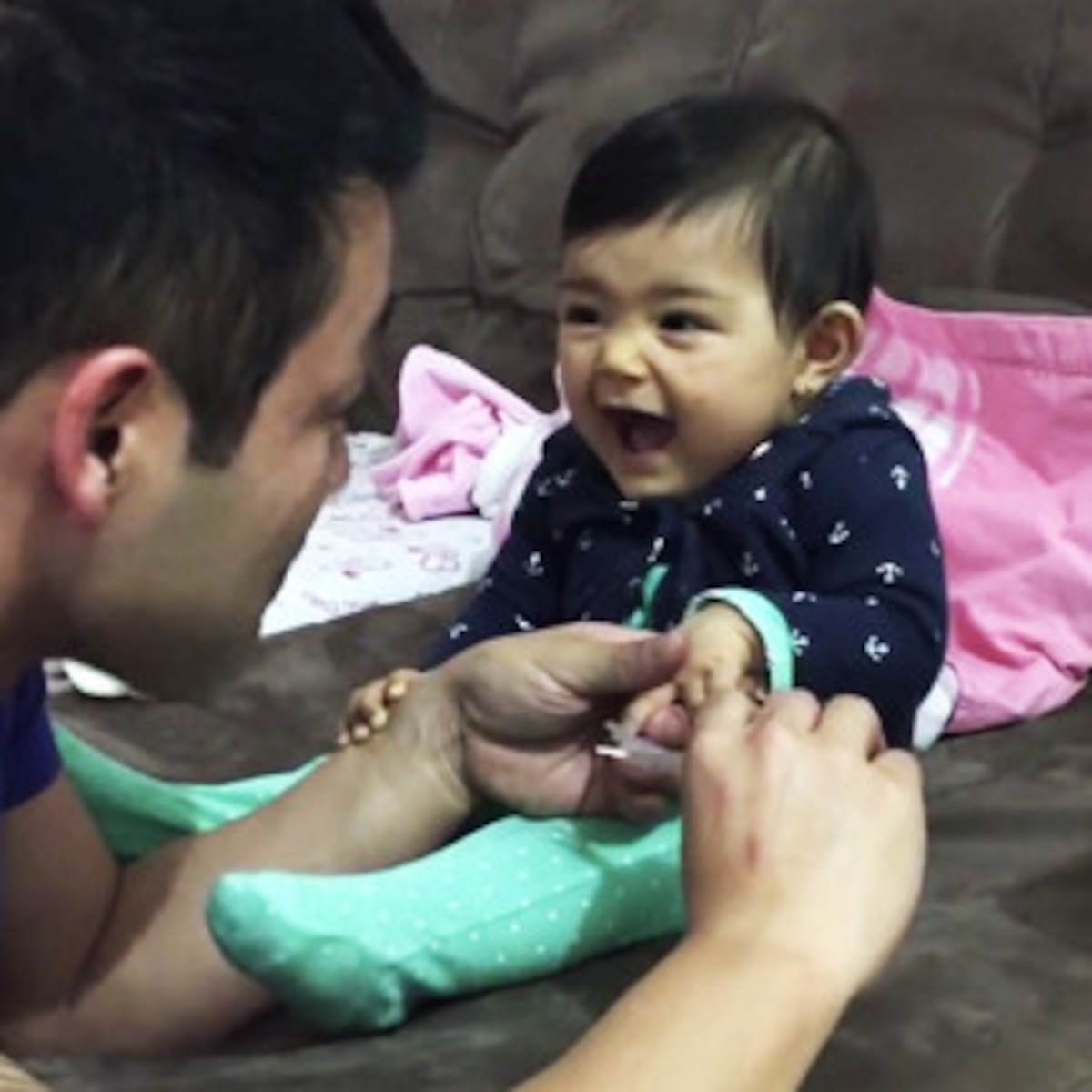 This Baby Can't Stop Scaring Daddy as He Tries to Cut Her Nails - E! Online