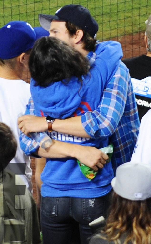 Mila Kunis wears pretty camisole as she catches a Dodgers game with fiance  Ashton Kutcher