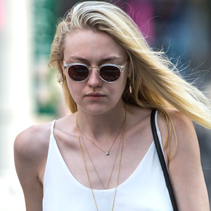 Dakota Fanning Goes Braless, Nips Out in a Thin White Tank Top—See the ...