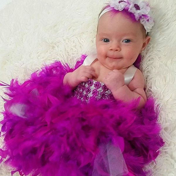 Coco S Baby Girl Chanel Rocking A Feather And Sequin Dress Will