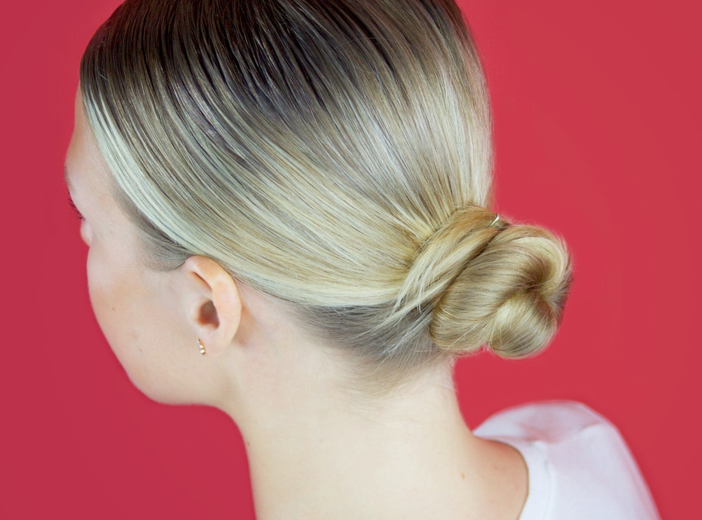 braided bun hairstyle. wears a extremely tight