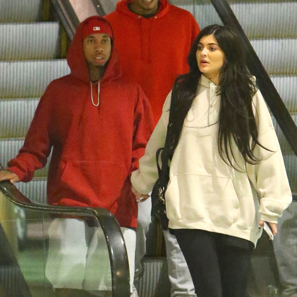 Kylie Jenner & Tyga Coordinate Their Black Outfits at LAX Airport