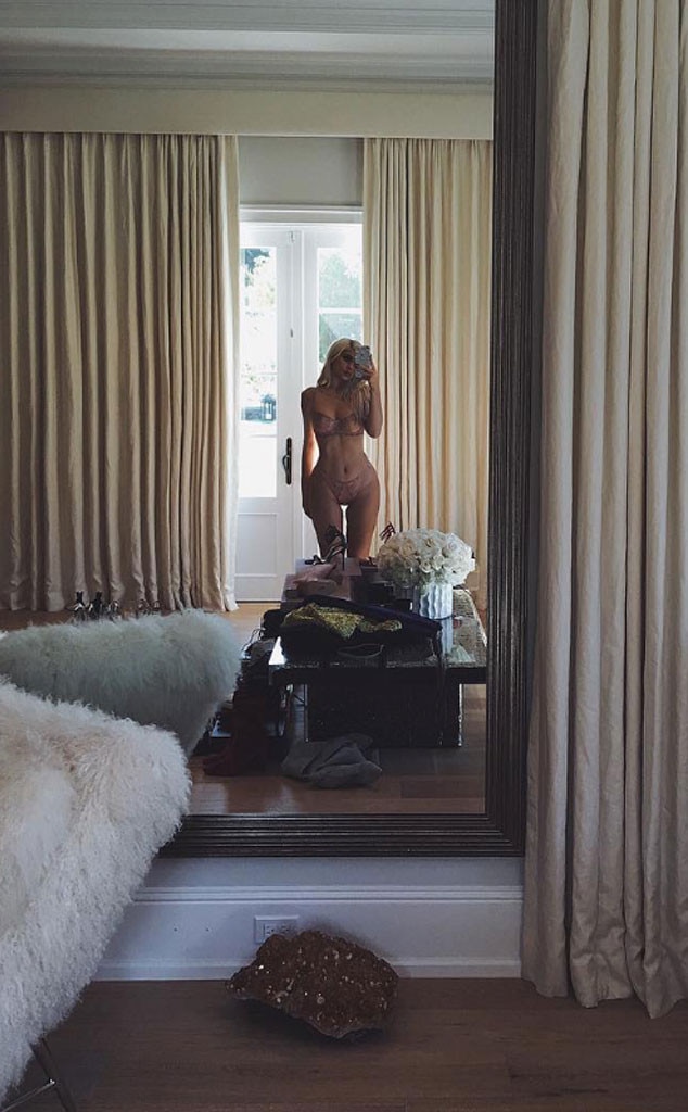 Kylie Jenner Strips Down to Nude Lingerie and Strikes a Sexy Pose