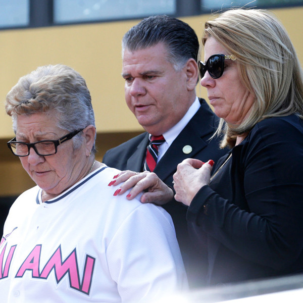 Olga Fernandez, of Cuba, left, walks with her daughter Maritza