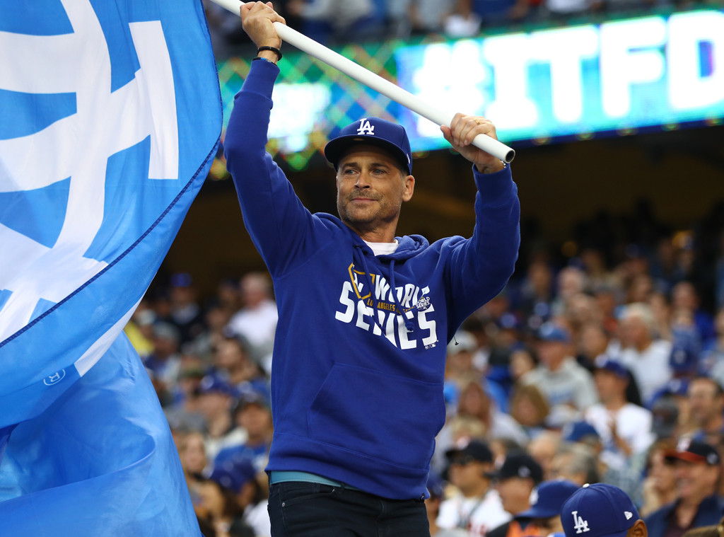 Rob Lowe and Jason Bateman sport fan merchandise at the LA Dodgers