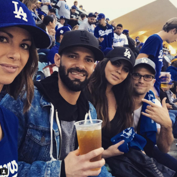 Rob Lowe and Jason Bateman sport fan merchandise at the LA Dodgers