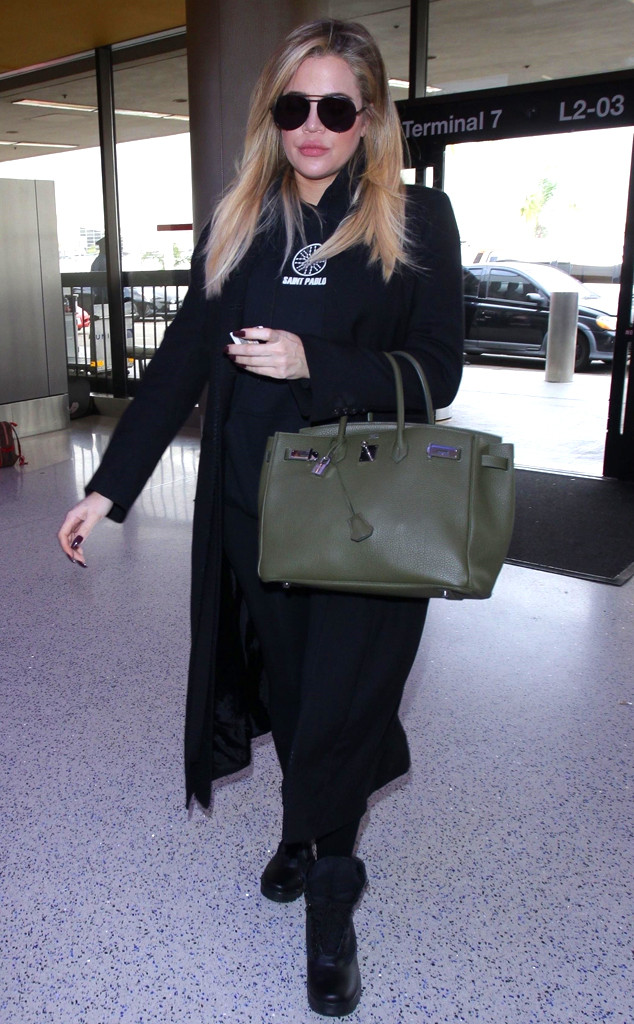 Khloe Kardashian shields her 'bump' with green Birkin bag