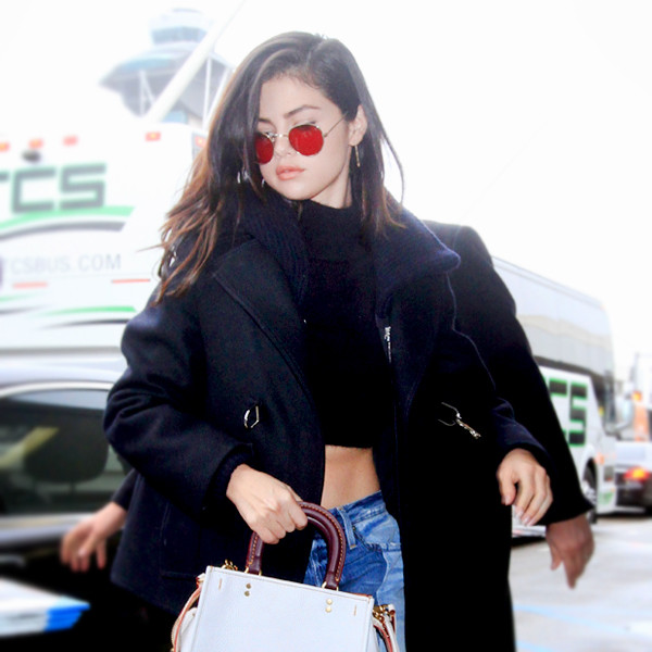Selena Gomez wearing Black Pea Coat, Black Cropped Sweater, Light