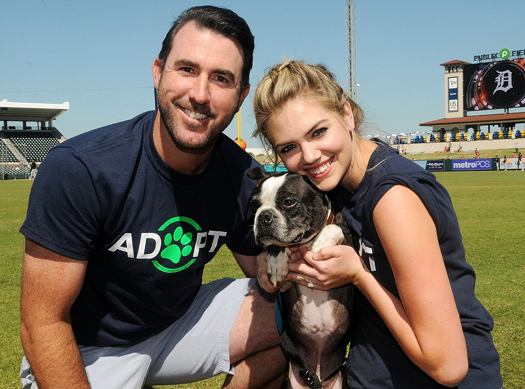 Kate Upton plants a kiss on husband Justin Verlander then he snuggles up to  daughter Genevieve
