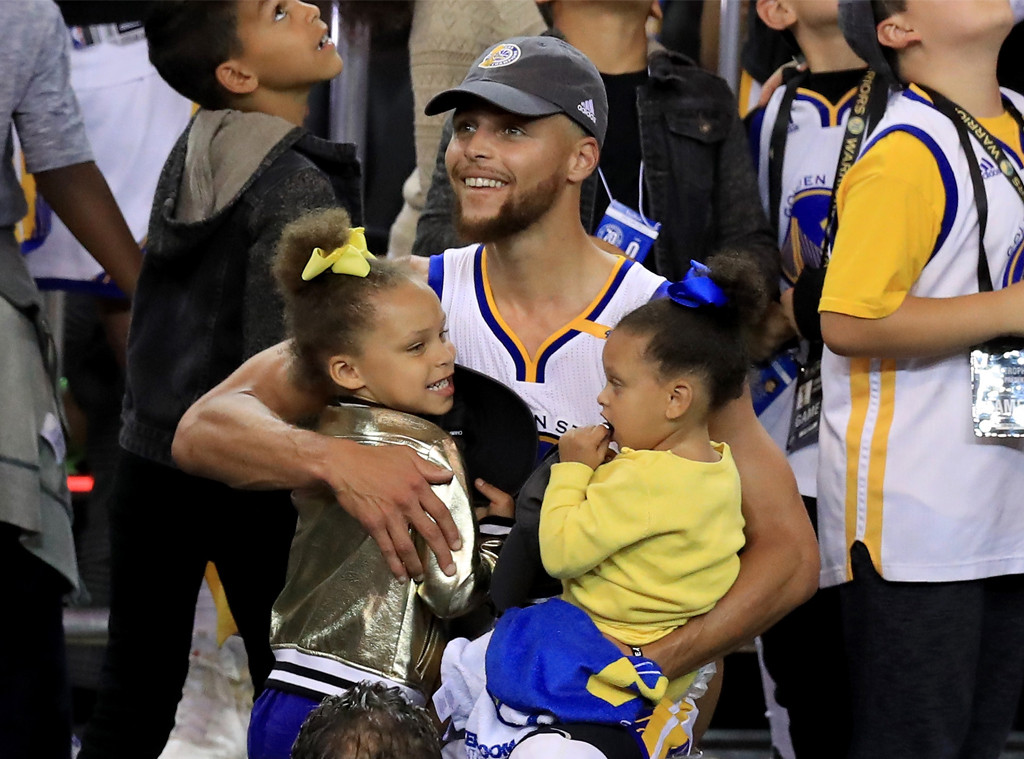 Steph Curry and family pose with championship trophy in adorable