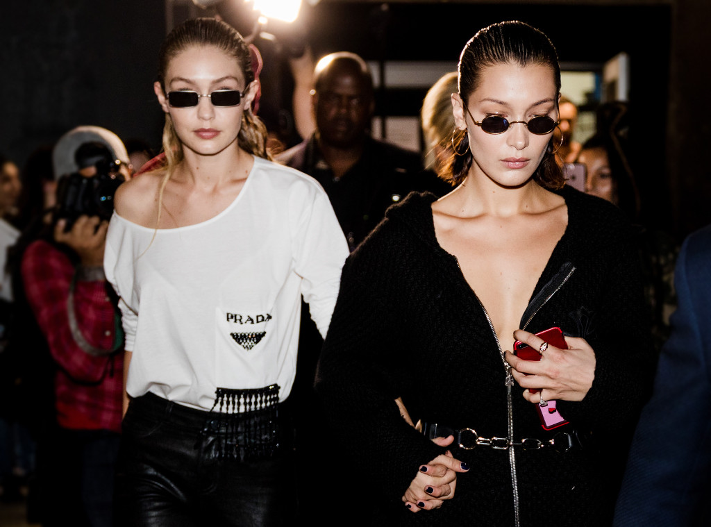 Lean on me: Bella Hadid lends sister Gigi a hand as she loses her shoe on  the catwalk