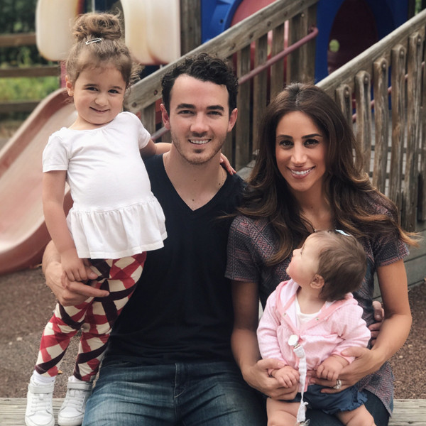Kevin Jonas and wife Danielle can't keep their hands off each